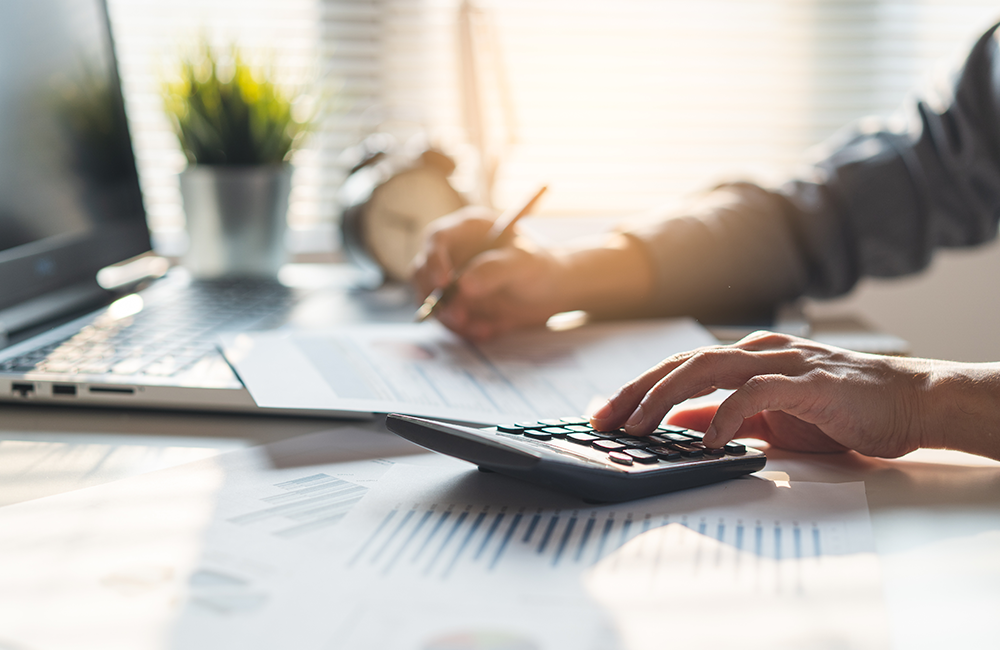 Man calculating how much to save in retirement